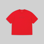 A bright red short-sleeve crewneck t-shirt with a subtle tonal dark red graphic across the chest, displayed flat against a solid light gray background.